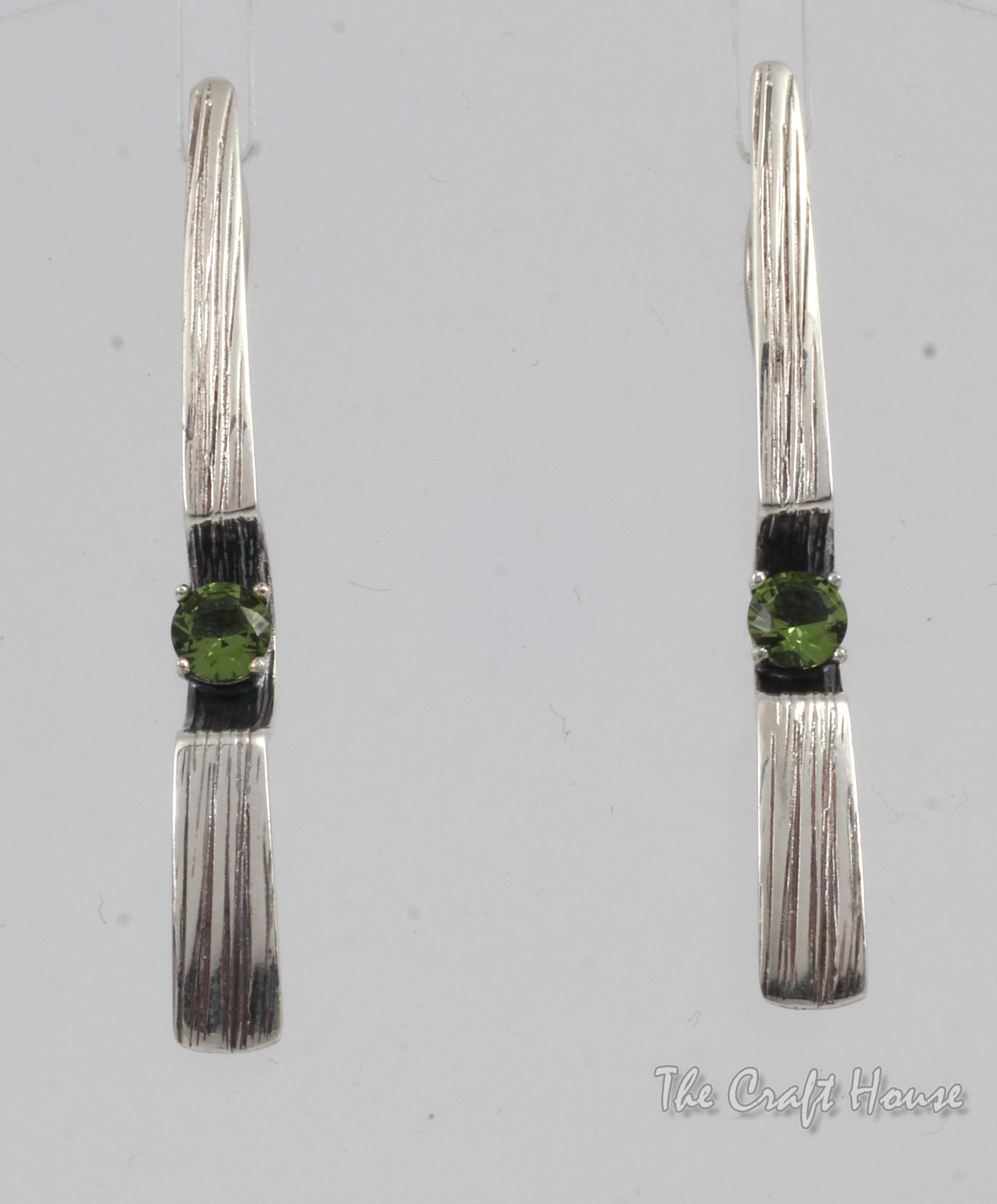 Silver earrings with Zultanite